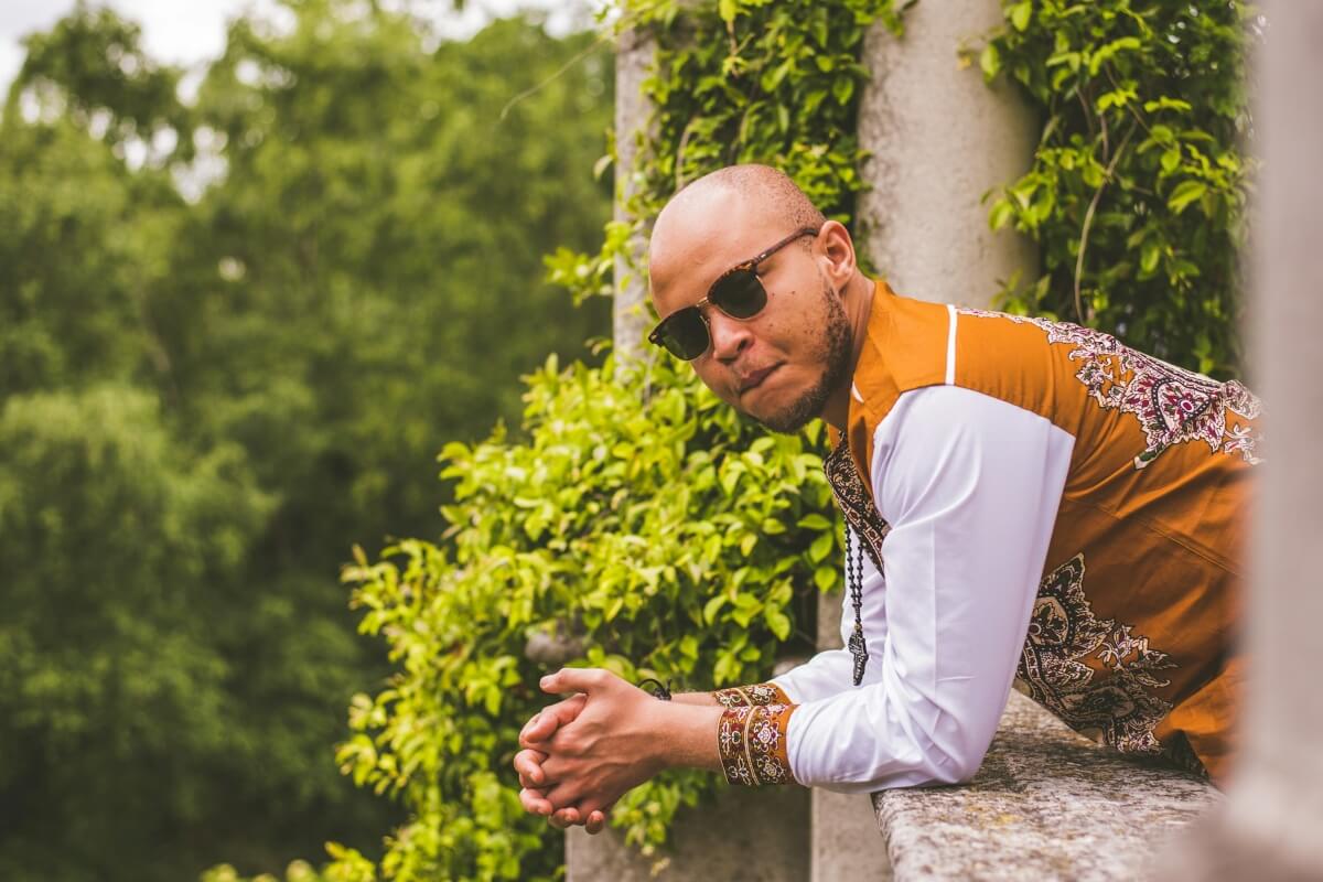 Confident bald man outdoors demonstrating total scalp sun protection against UV rays